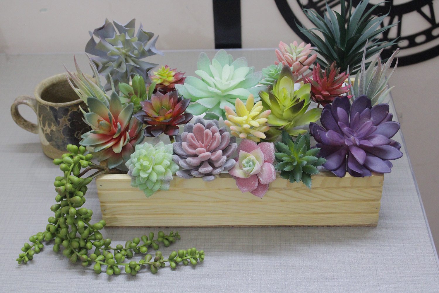 decorous fake succulents arrangement in wooden box for home decor